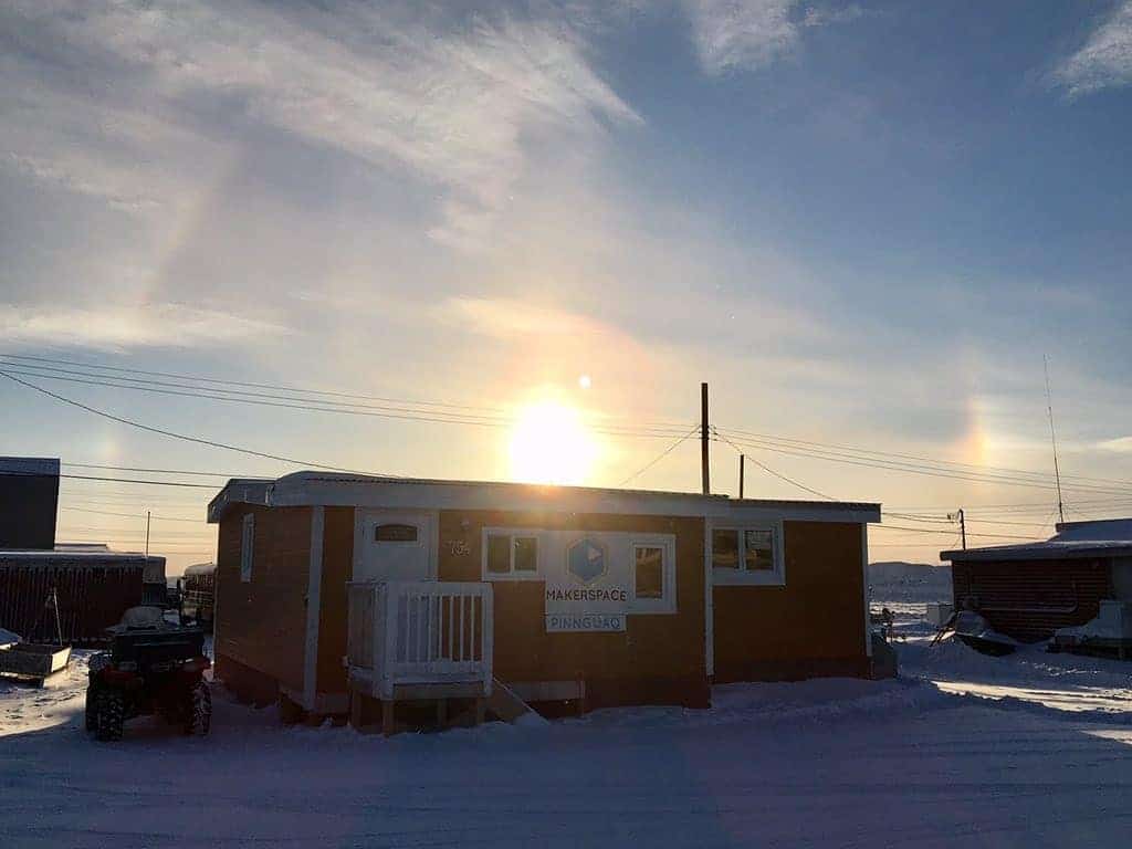 Pinnguaq Iqaluit makerspace with sun setting in the background