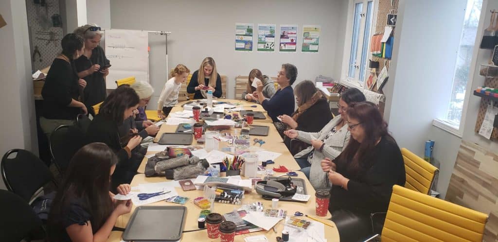 group of woman in a beading workshop at the lindsay makerspace