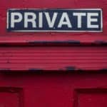 private sign on a red building