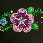 A purple quillwork and beadwork flower by 4 Sisters Métis Beadwork.