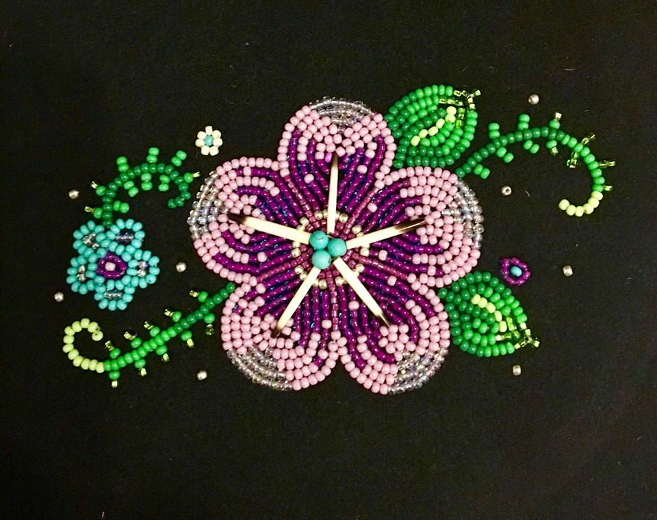 A purple quillwork and beadwork flower by 4 Sisters Métis Beadwork.