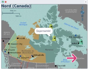 Critter on a map of Nunavut saying "Qujannamiik!"