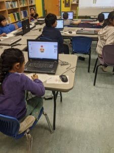 A student creating digital art using a computer.