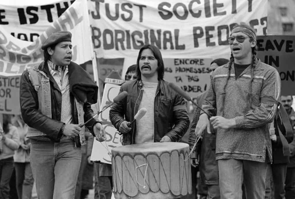 3 indigenous men drumming at the march on Parliament Hill on November 16, 1981.
