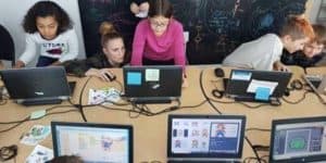 A class of students working on their computers.