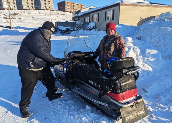 Participants gathering real-world audio from a snowmobile for their game.