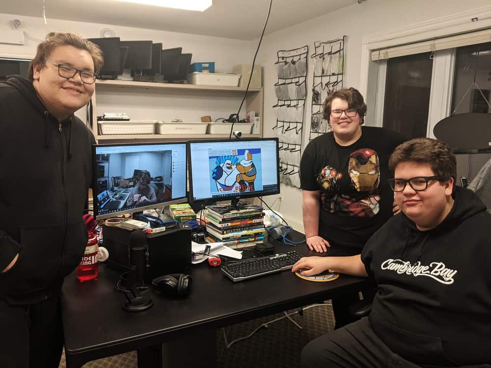 Three participants showcasing their game on a computer during the Nunavut Global Game Jam.