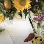 Flowers laid out on a white piece of paper.